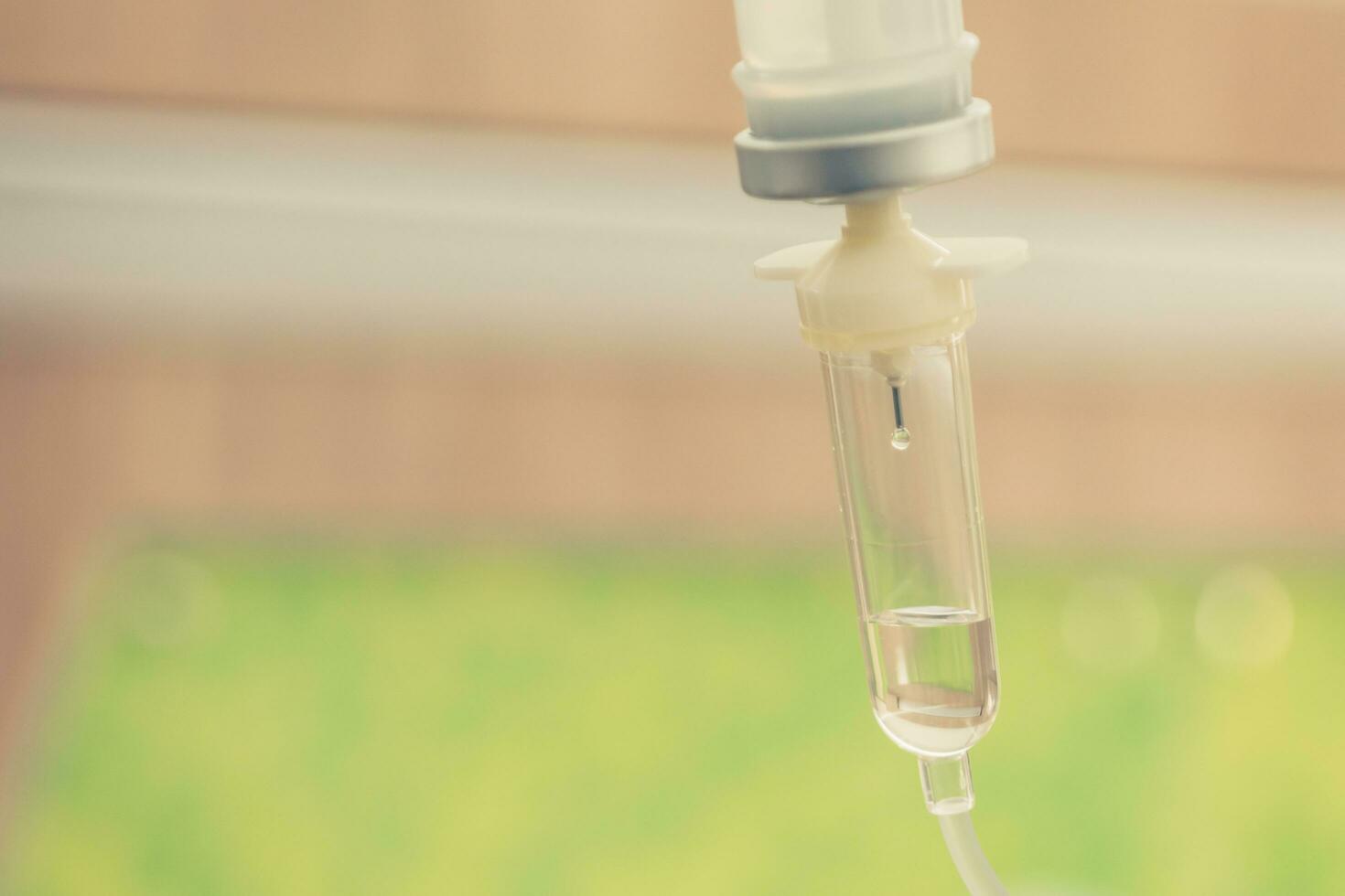 Saline solution drip for treatment patient in the hospital. photo