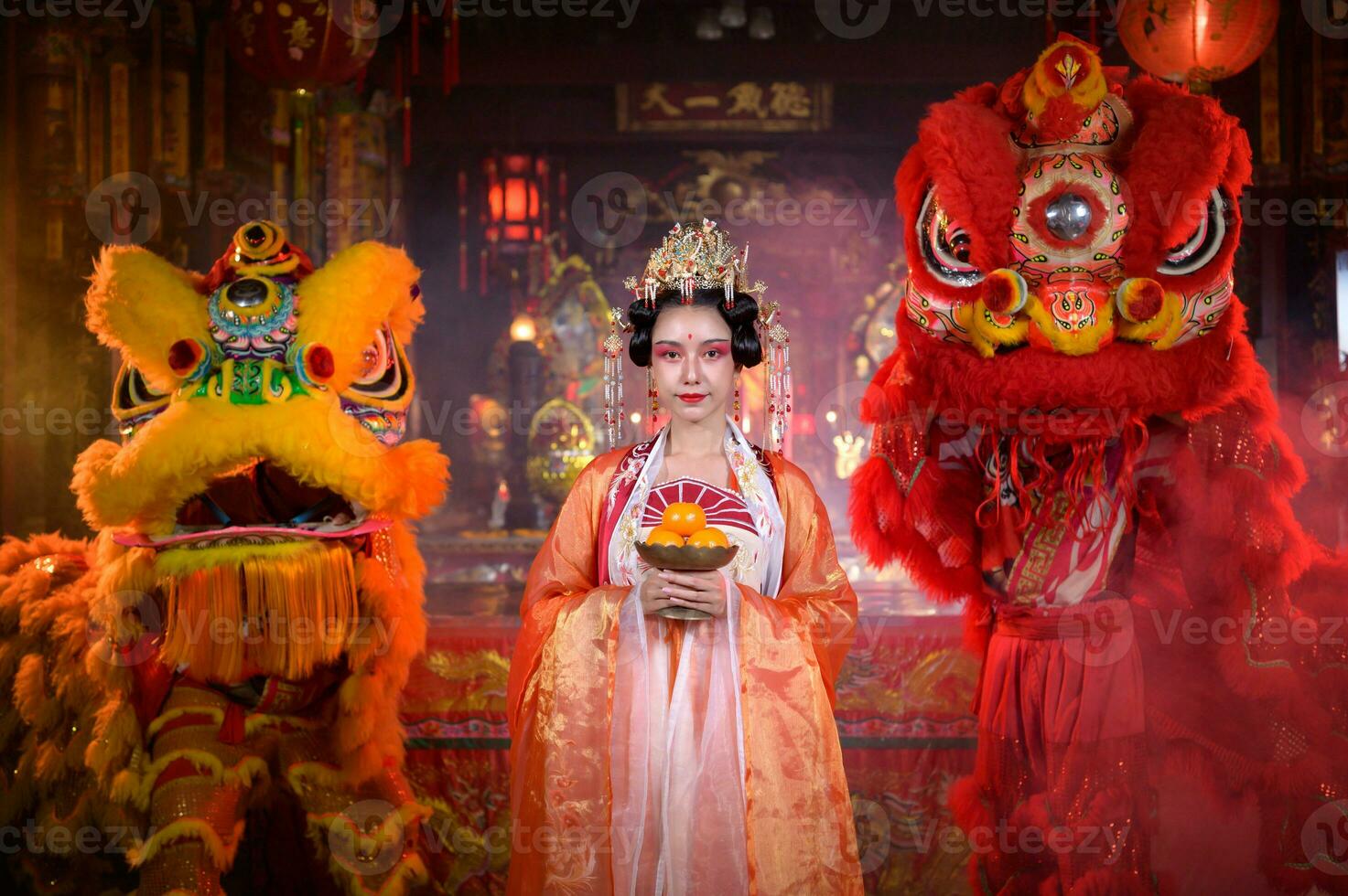 Chinese woman with yellow and red lions It is considered to enhance the prosperity for oneself on the occasion of the Chinese New Year festival every year photo