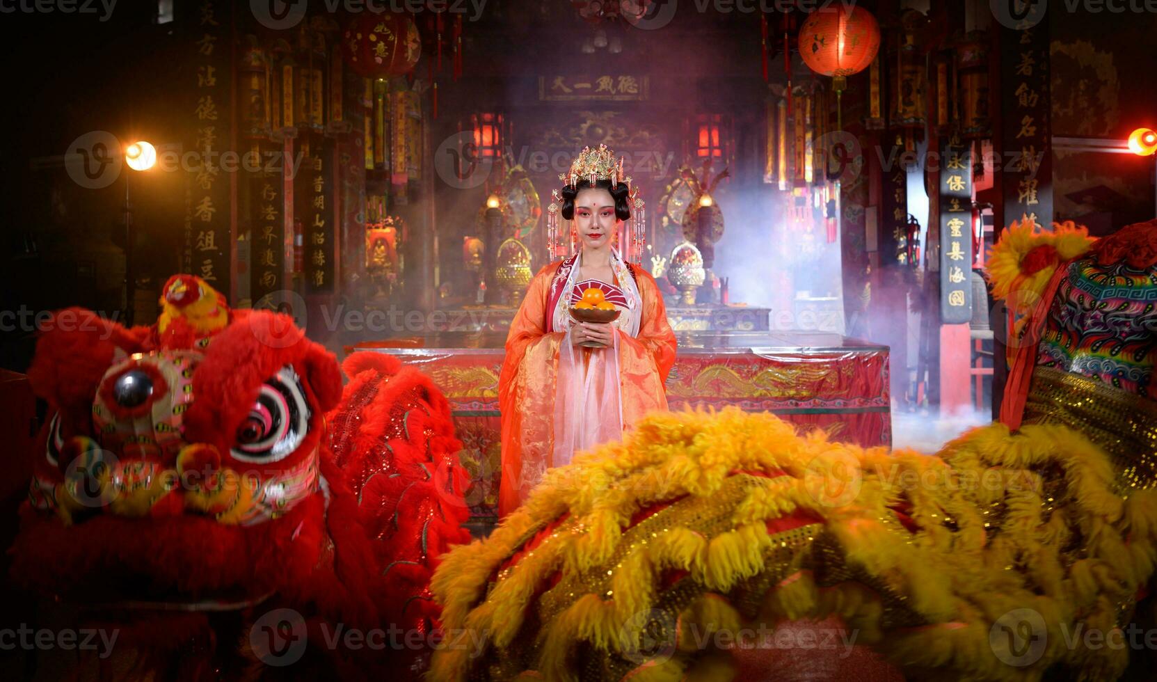 Chinese woman with yellow and red lions It is considered to enhance the prosperity for oneself on the occasion of the Chinese New Year festival every year photo