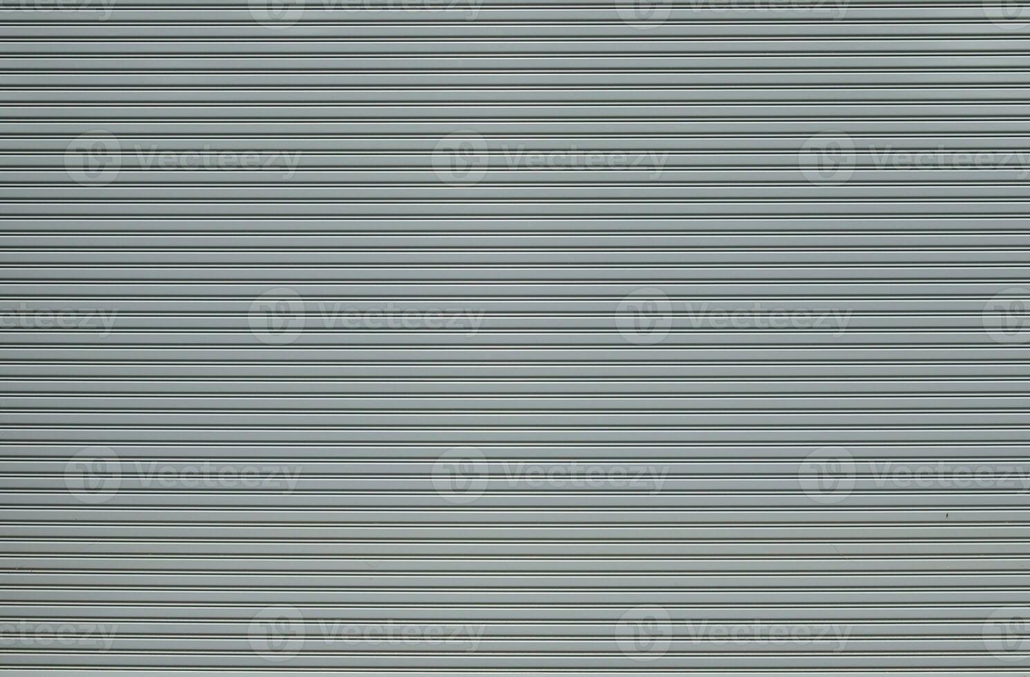 Gray metalic shutter background.  Roller shutter door texture background photo