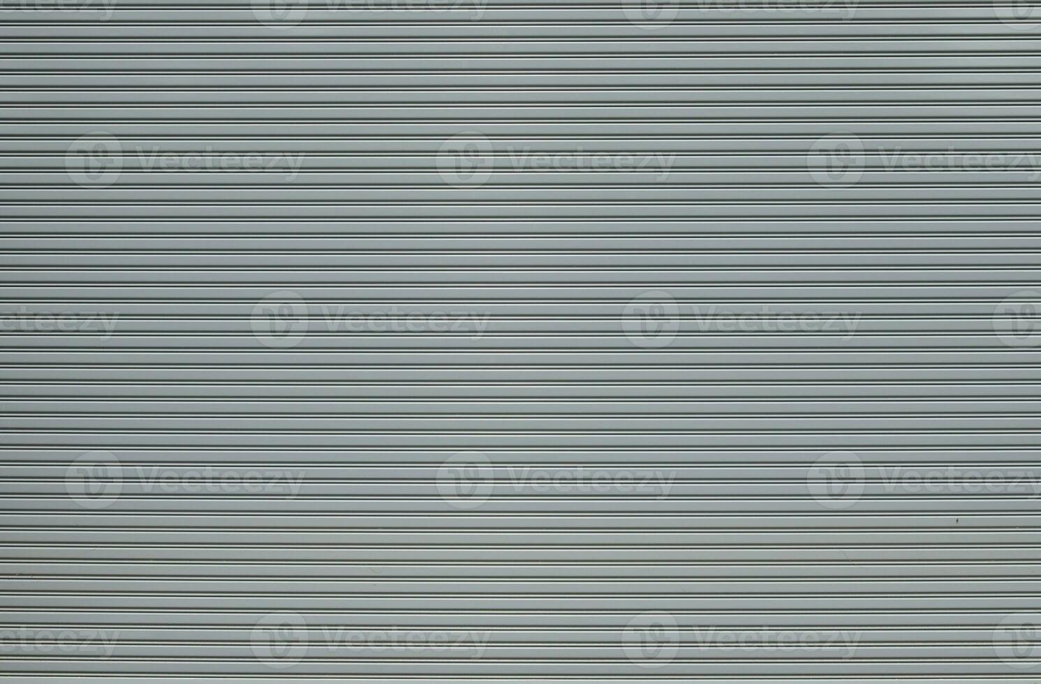 Gray metalic shutter background.  Roller shutter door texture background photo