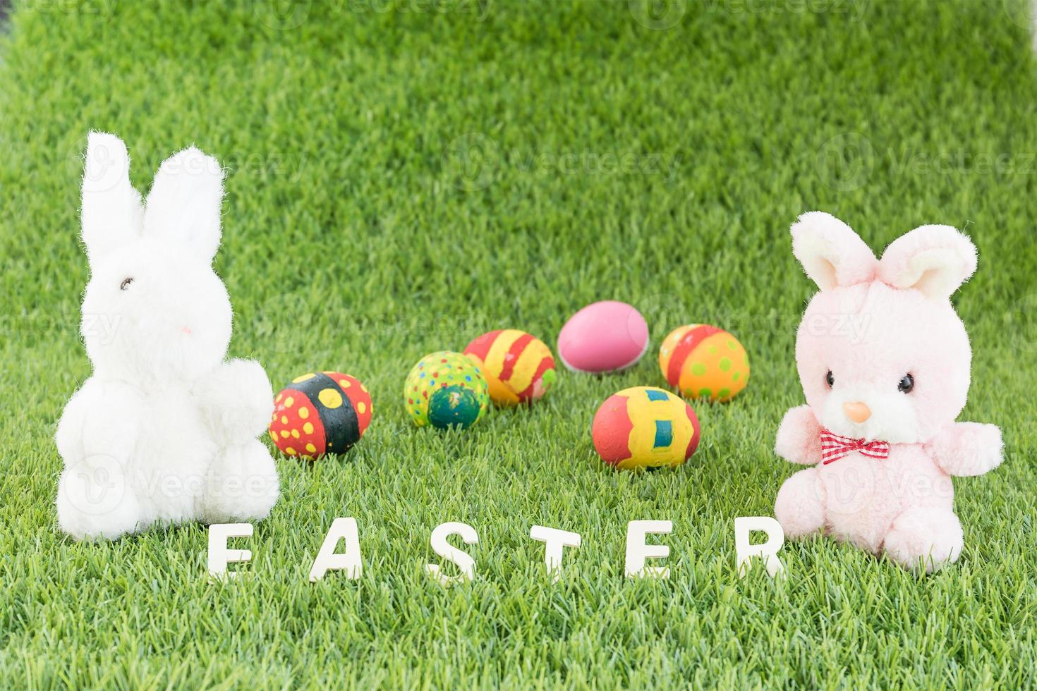 Bunny toys and Easter eggs with text photo