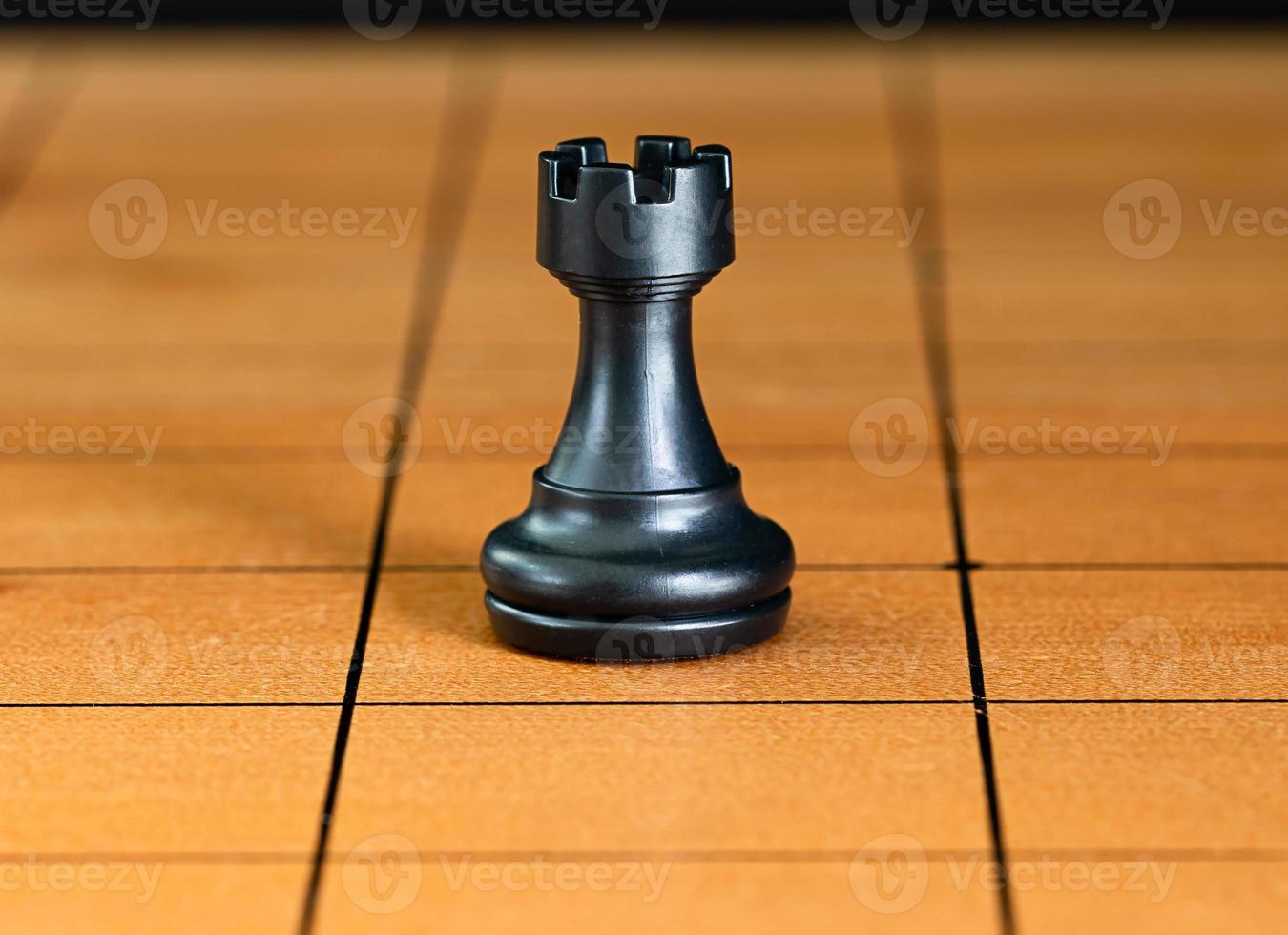 Chess pieces on a wood chessboard photo