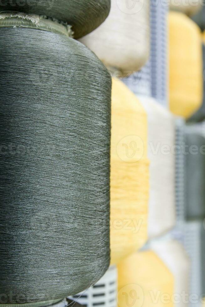 Silk thread spools in row photo