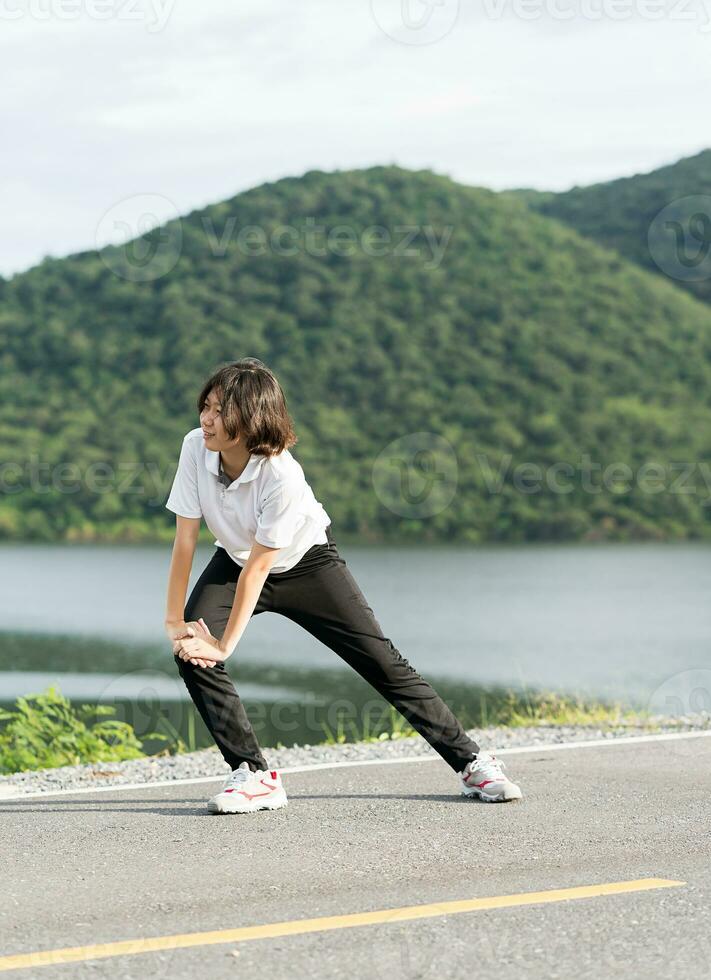 Woman short hair doing exercising outdoor photo