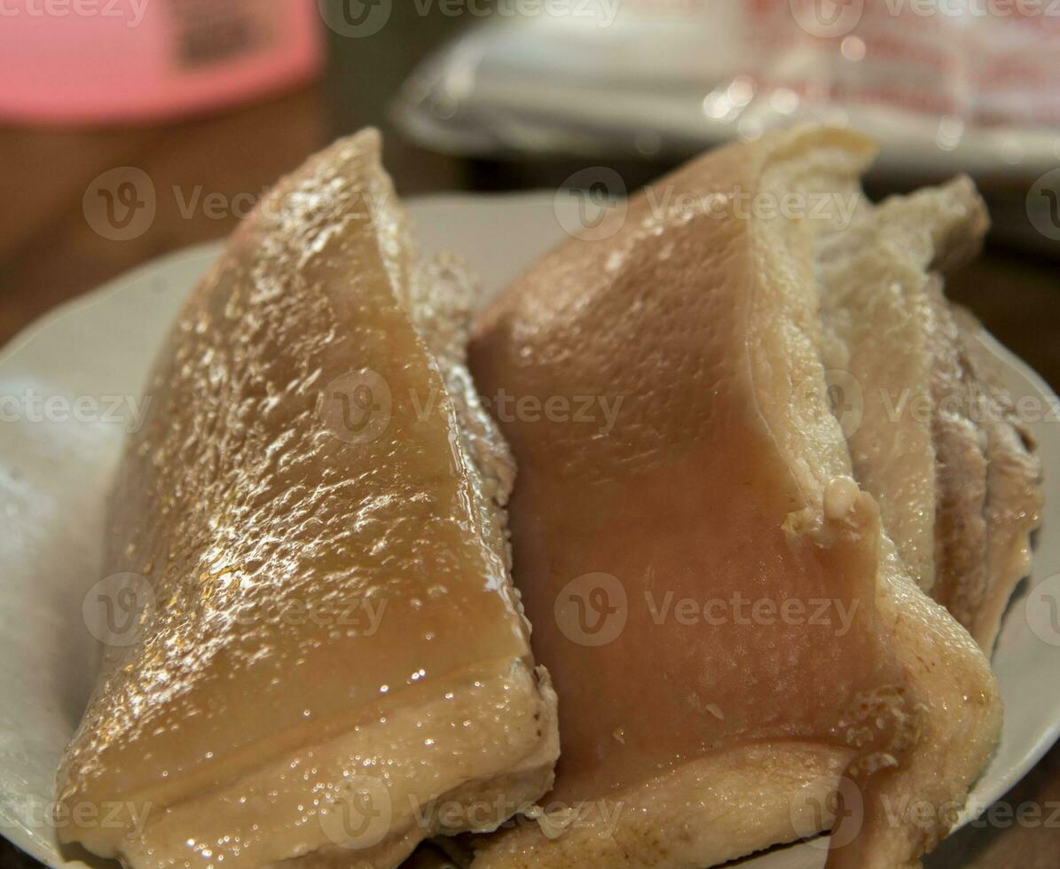 Boiled Pork Belly - Making - Crispy Fried Pork Belly - An ancient recipe requires skill, expertise and patience. It is a very delicious Thai-Chinese recipe that is street food in Thailand. photo