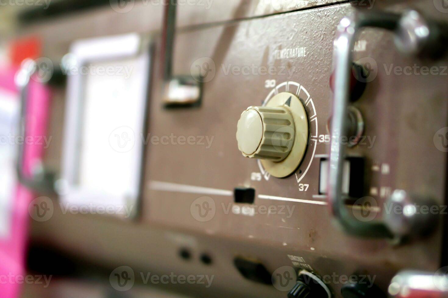 Close up button and power switch of old and obsolete temp baby incubator in the hospital. photo