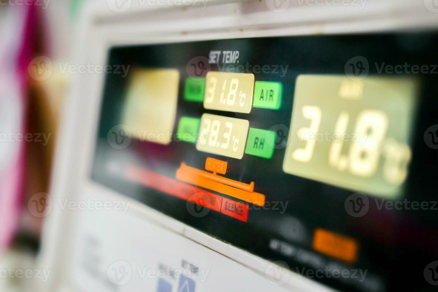 Close up of Temp monitor of baby incubator in the hospital with show the number of temperatures used to warm the sick newborn inside. photo