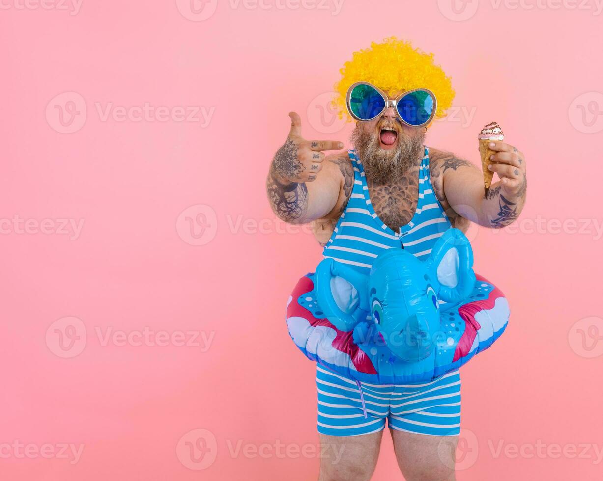 Fat man with beard and wig eats an icecream photo