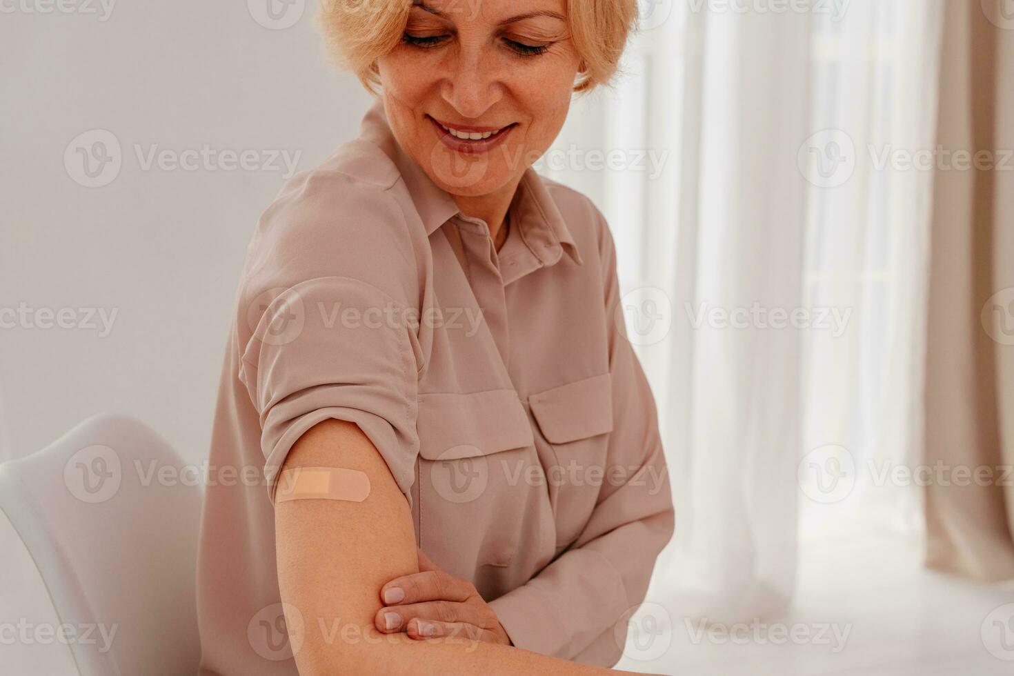 Patient with patch on the arm did the covid-19 vaccine photo