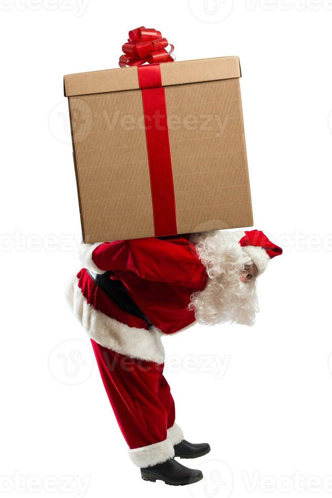 Santa claus carry a big christmas gift photo