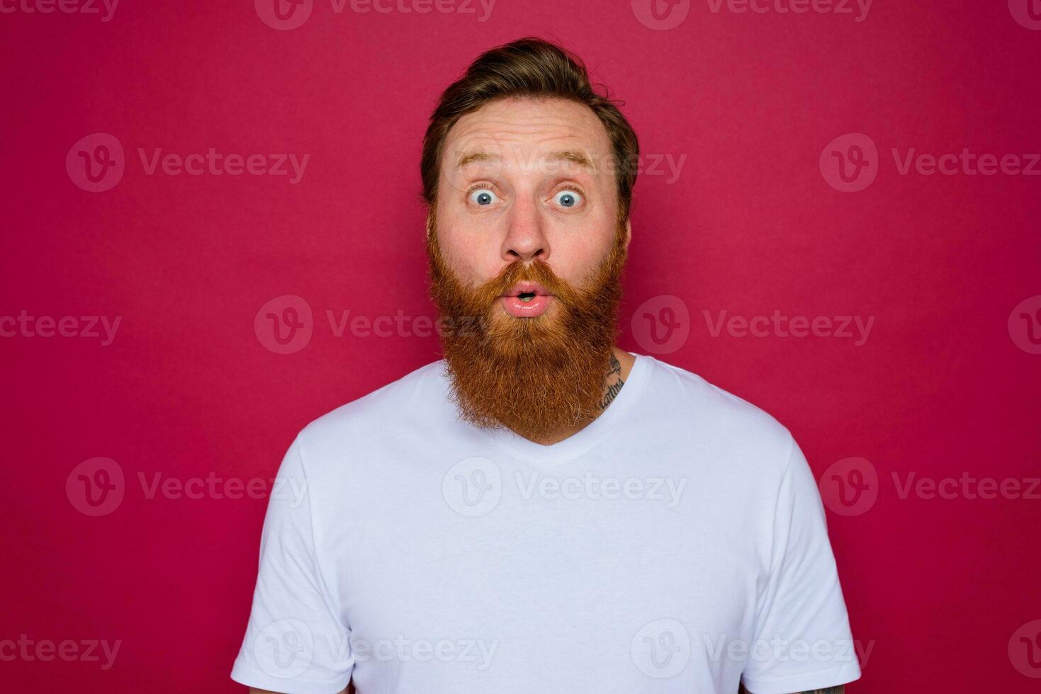 wondered isolated man with beard and white t-shirt photo