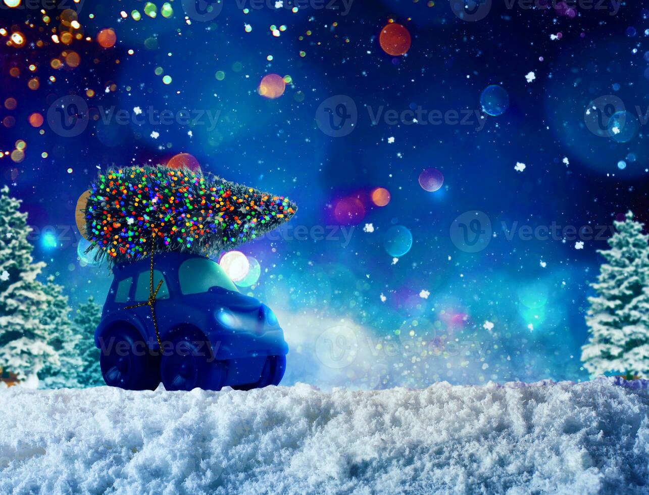 Ready to xmas with a Christmas tree on the roof of a toy car photo