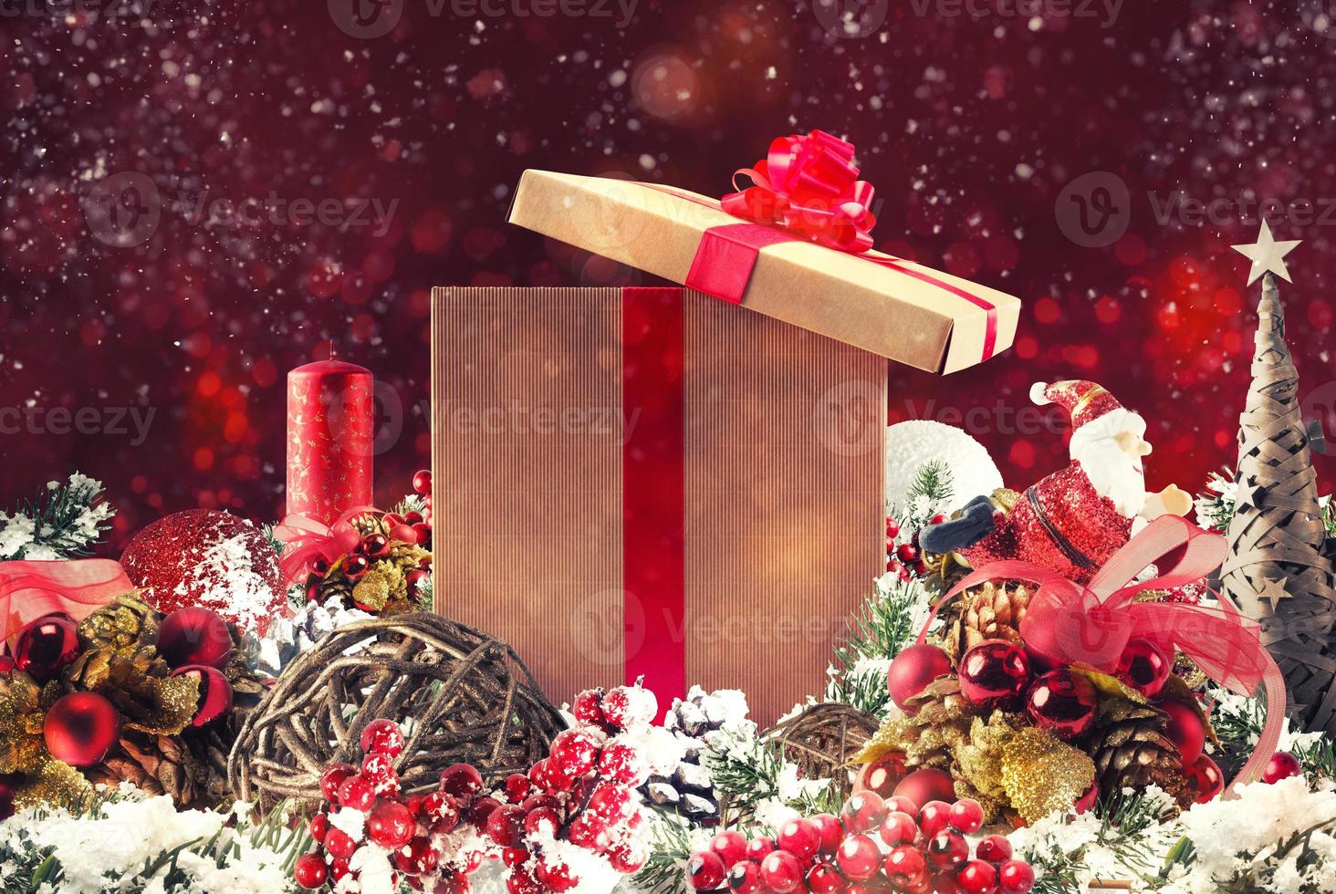 Christmas background concept. Shimmering Christmas decorations with gift, tree, Santa Claus and candles photo