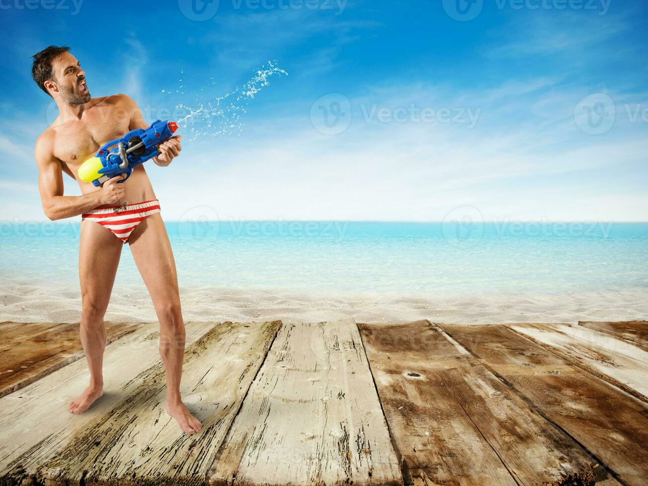 Boy play with water gun photo