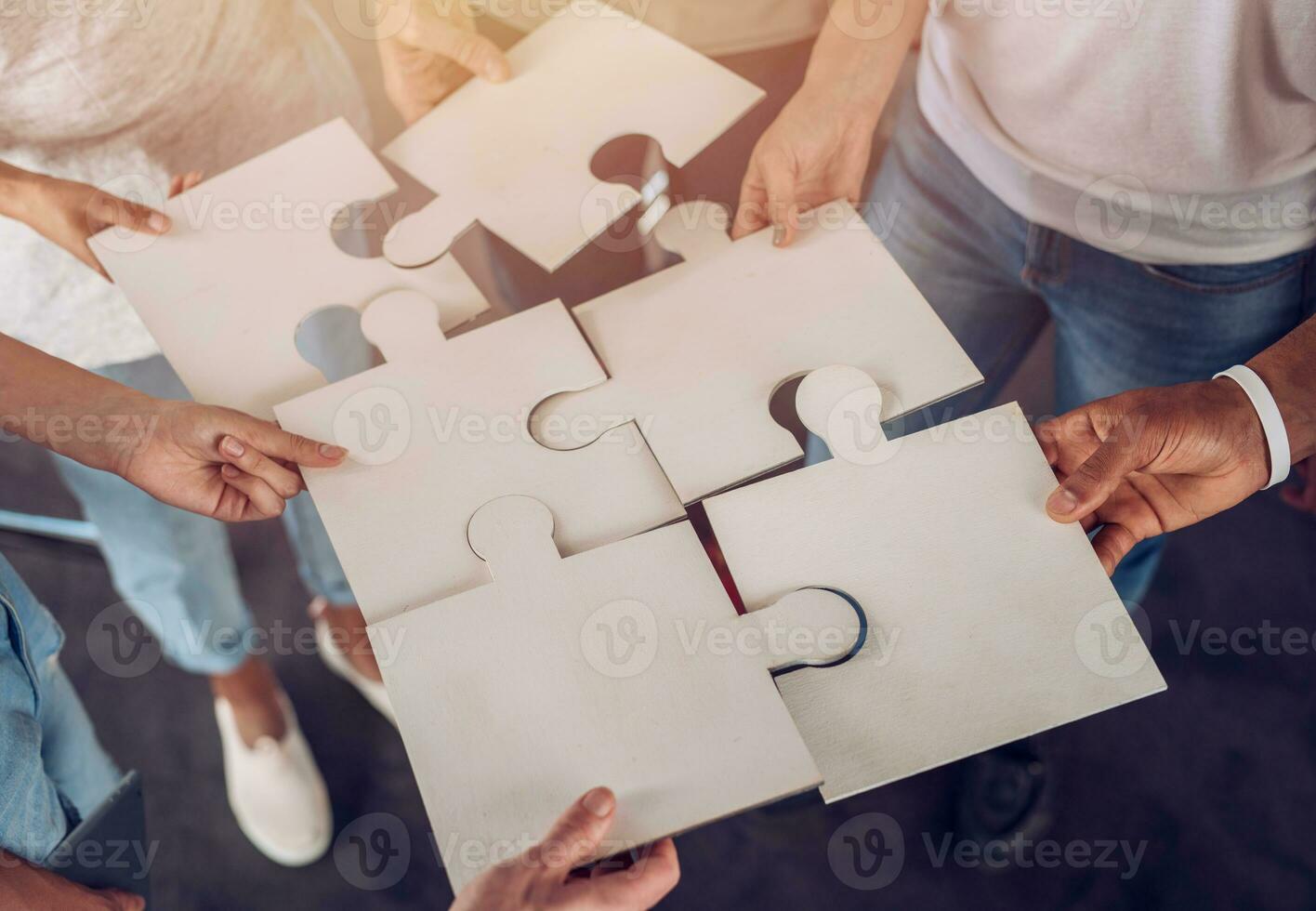 Teamwork of partners. Concept of integration and startup with puzzle pieces photo