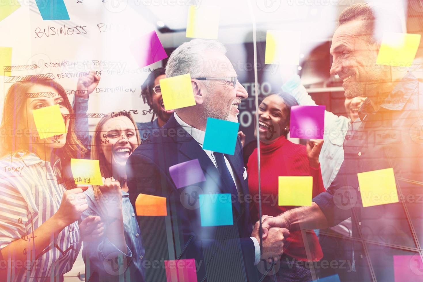 Team of happy people work together. concept of teamwork, partnership and success photo