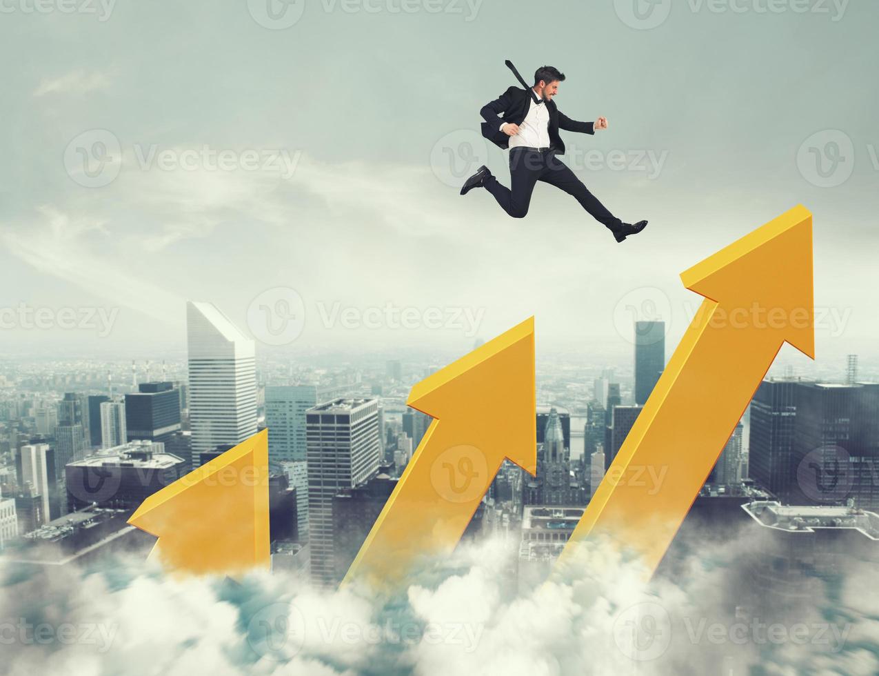 Businessman jumps on increasing statistic arrows to reach the top photo