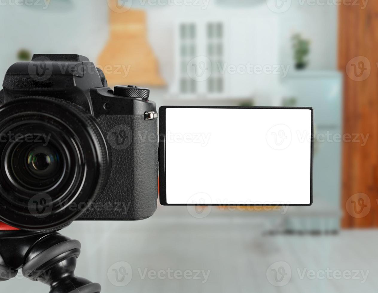 Modern mirrorless camera ready to records with blank screen photo