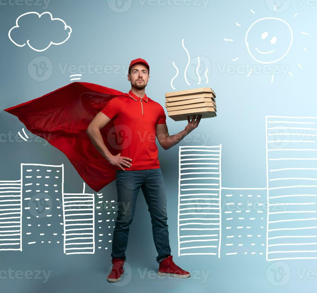 Deliveryman with pizzas acts like a powerful superhero. Concept of success and guarantee on shipment. Studio cyan background photo