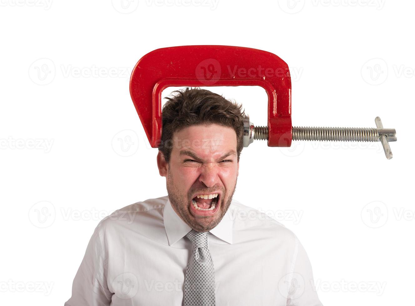 Businessman with a vise on his head. concept of headache photo
