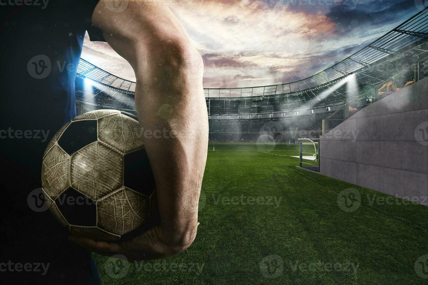 Soccer player ready to play with ball in his hand at the entrance of the football field photo