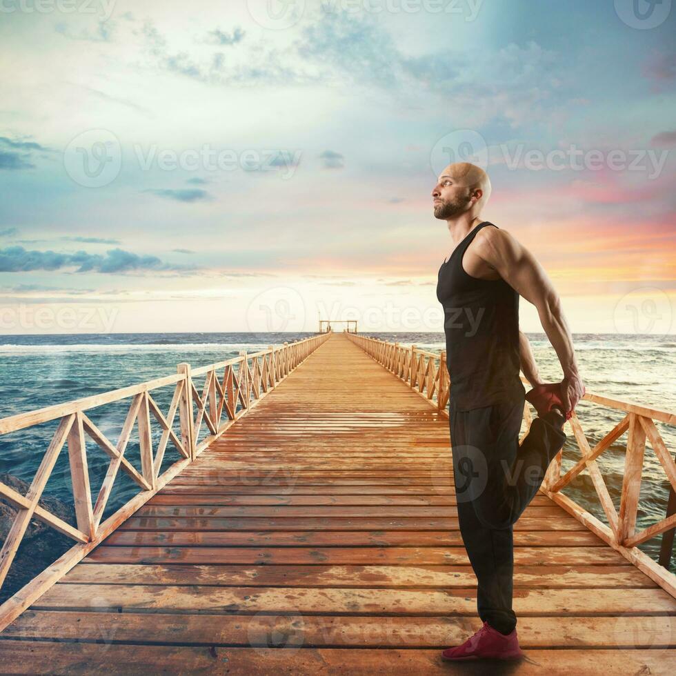 Exercises of gymnastics on a pier photo