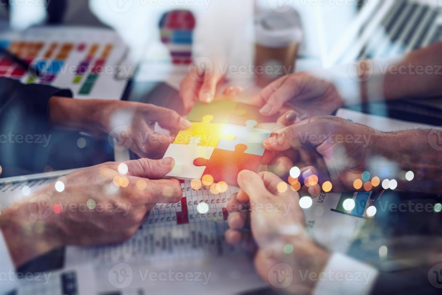 Teamwork of partners. Concept of integration and startup with puzzle pieces photo