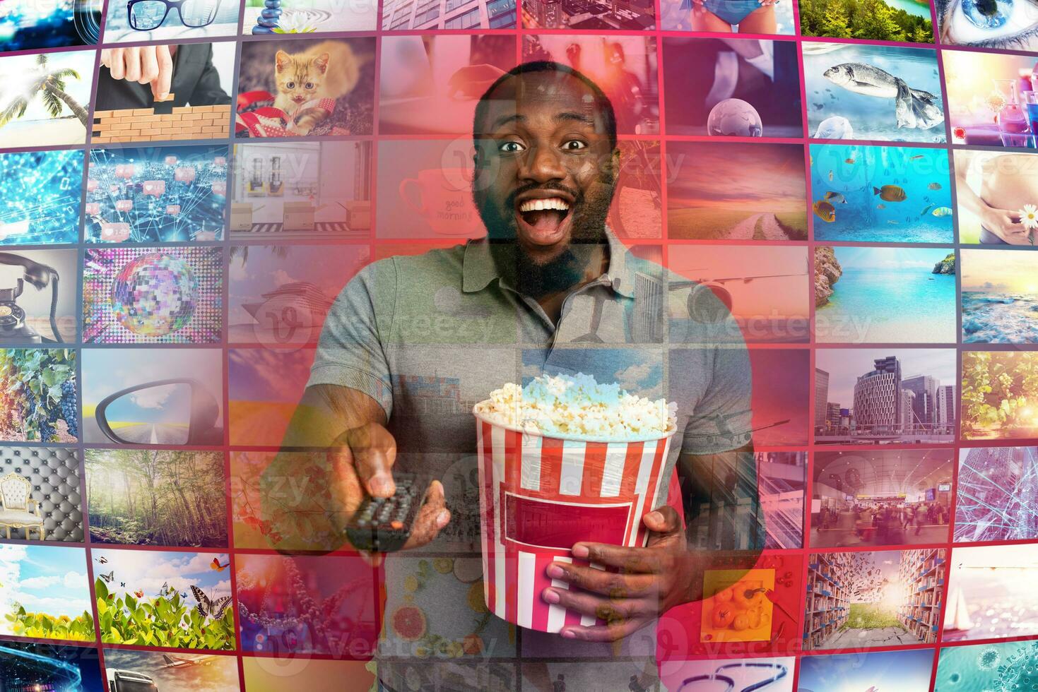 Man has fun watching a film. Concept of entertainment and streaming tv. red background photo