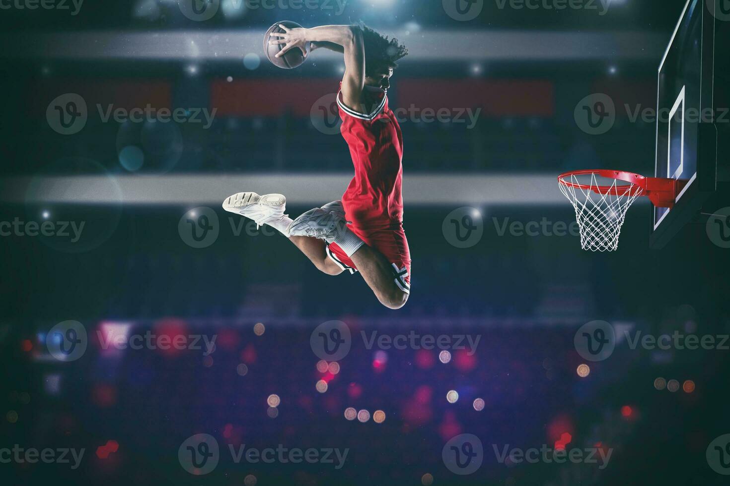 Basketball game with a high jump player to make a slam dunk to the basket photo