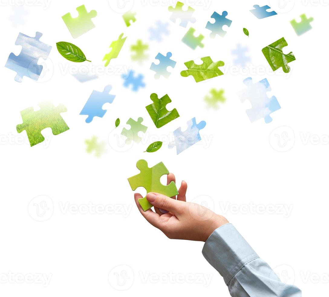 Isolated puzzle pieces and hand photo