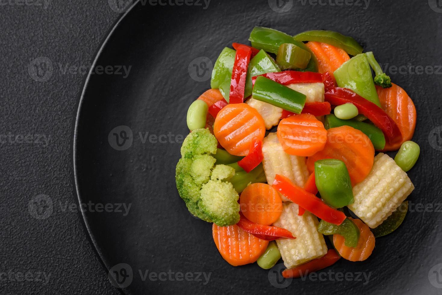 Delicious juicy broccoli vegetables, carrots, asparagus beans and bell peppers photo