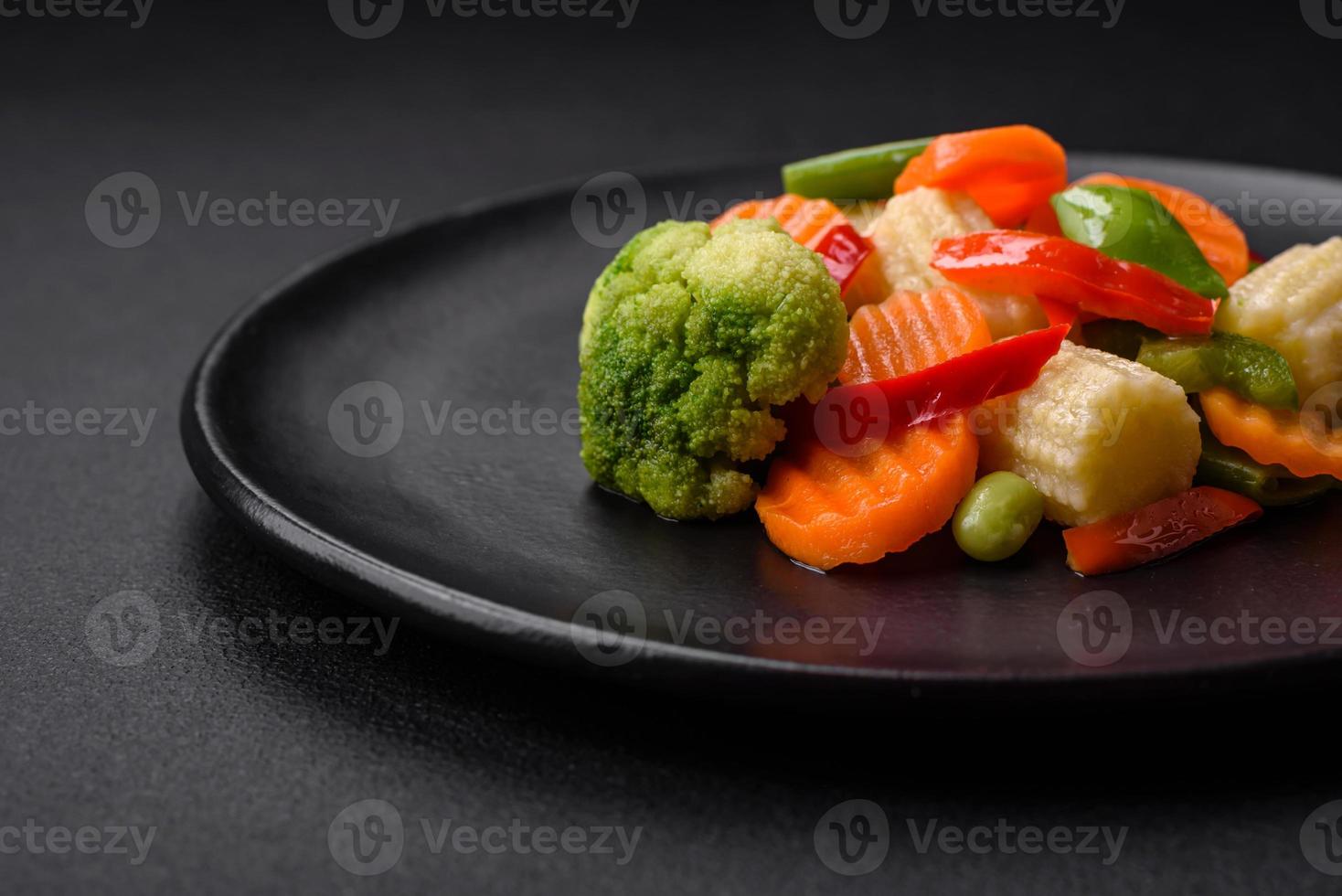 Delicious juicy broccoli vegetables, carrots, asparagus beans and bell peppers photo