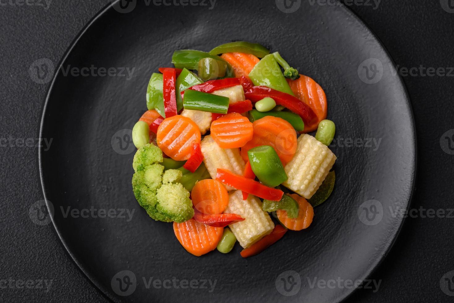 Delicious juicy broccoli vegetables, carrots, asparagus beans and bell peppers photo