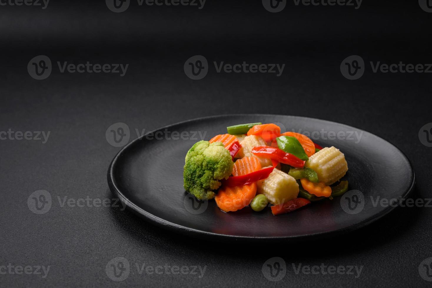 Delicious juicy broccoli vegetables, carrots, asparagus beans and bell peppers photo