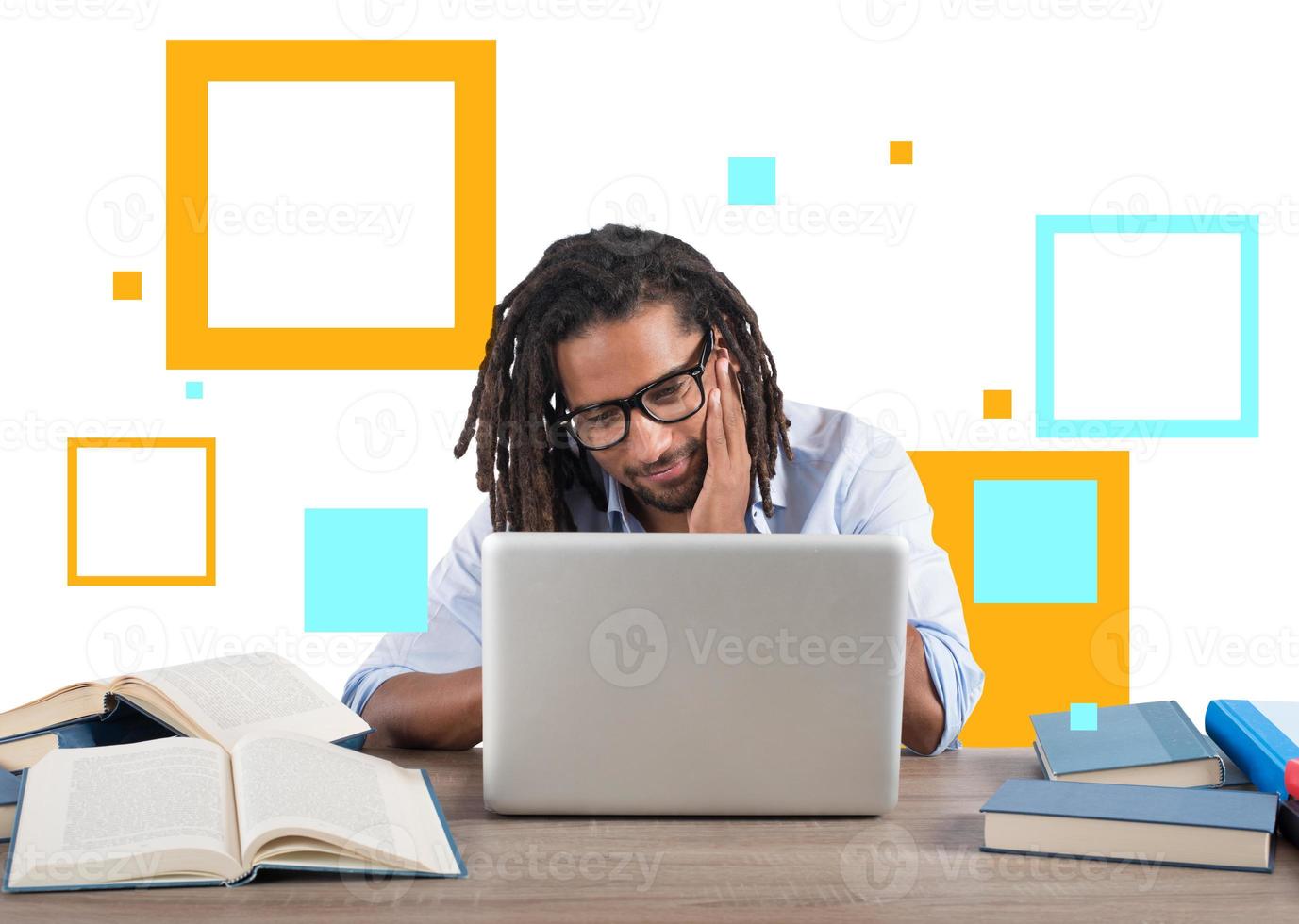 Student studies with his laptop with a desk full of books. Concept on online exam photo