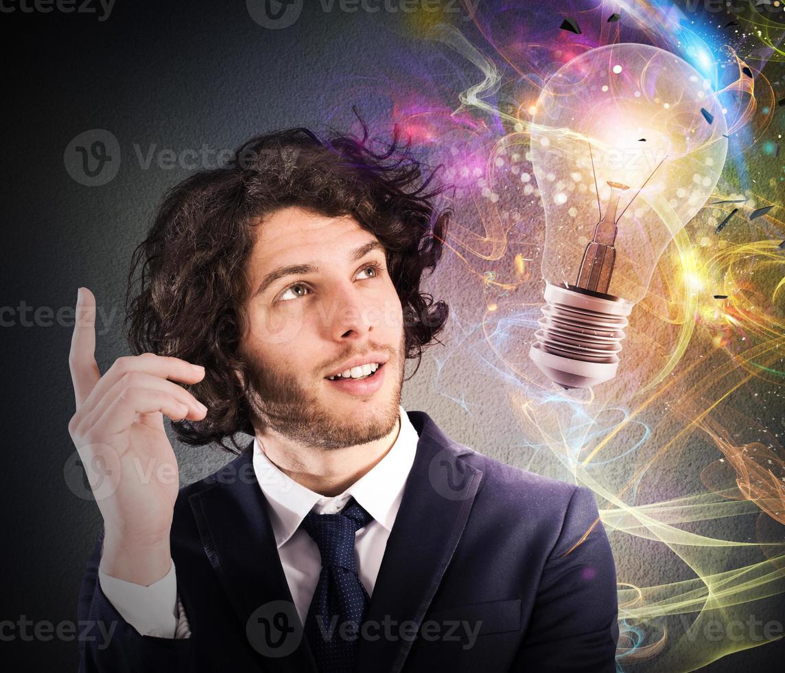 Businessman thinks of a new creative idea photo