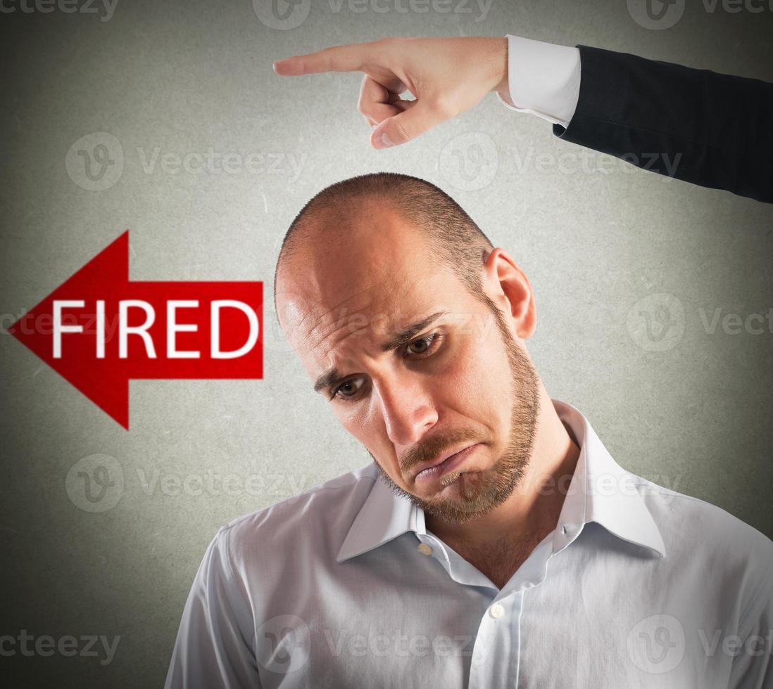 Sad fired businessman photo