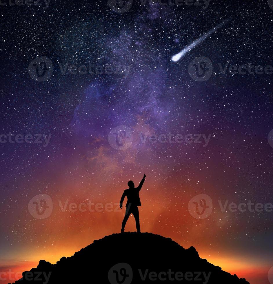 Businessman indicate a falling star photo