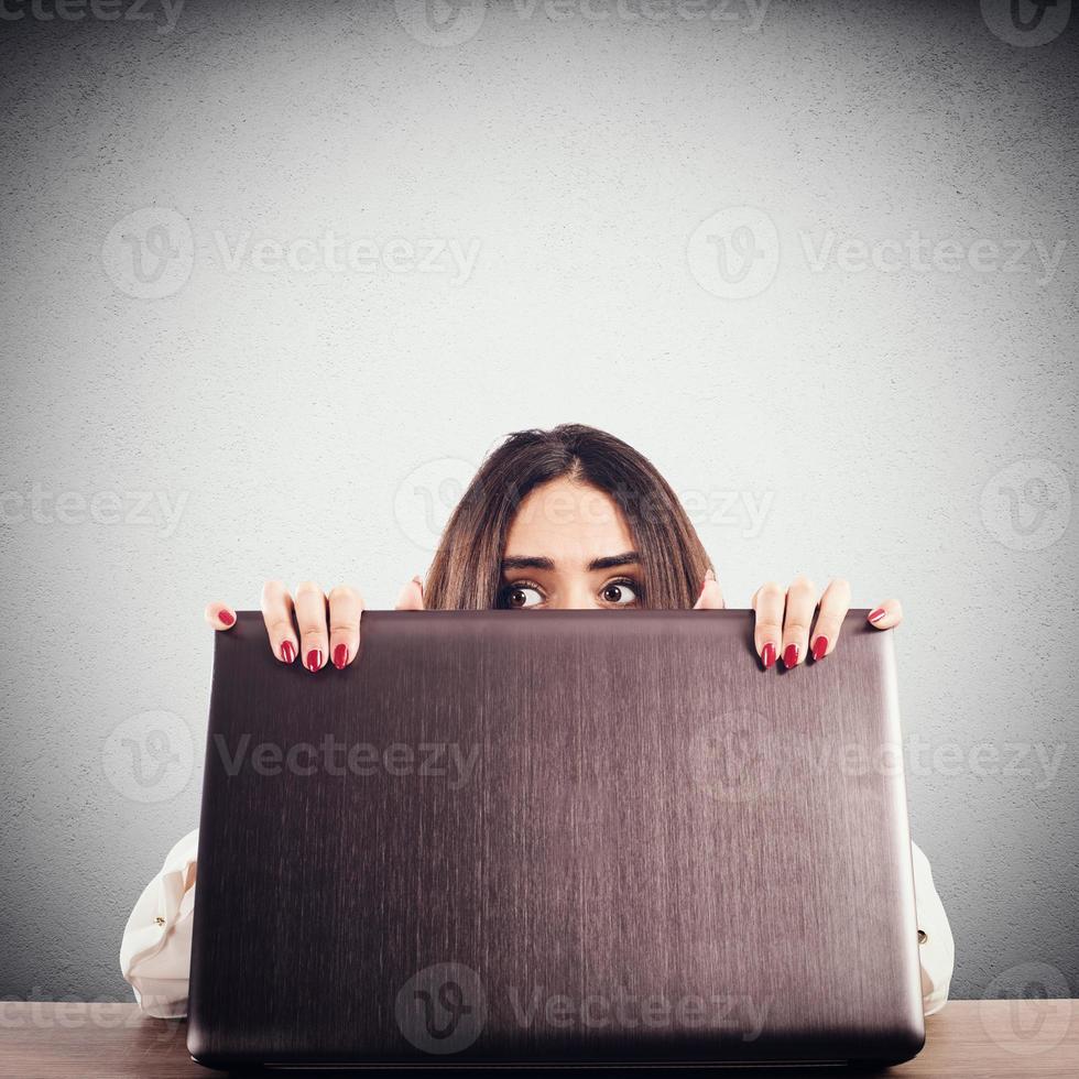 Businesswoman peeks secretly photo