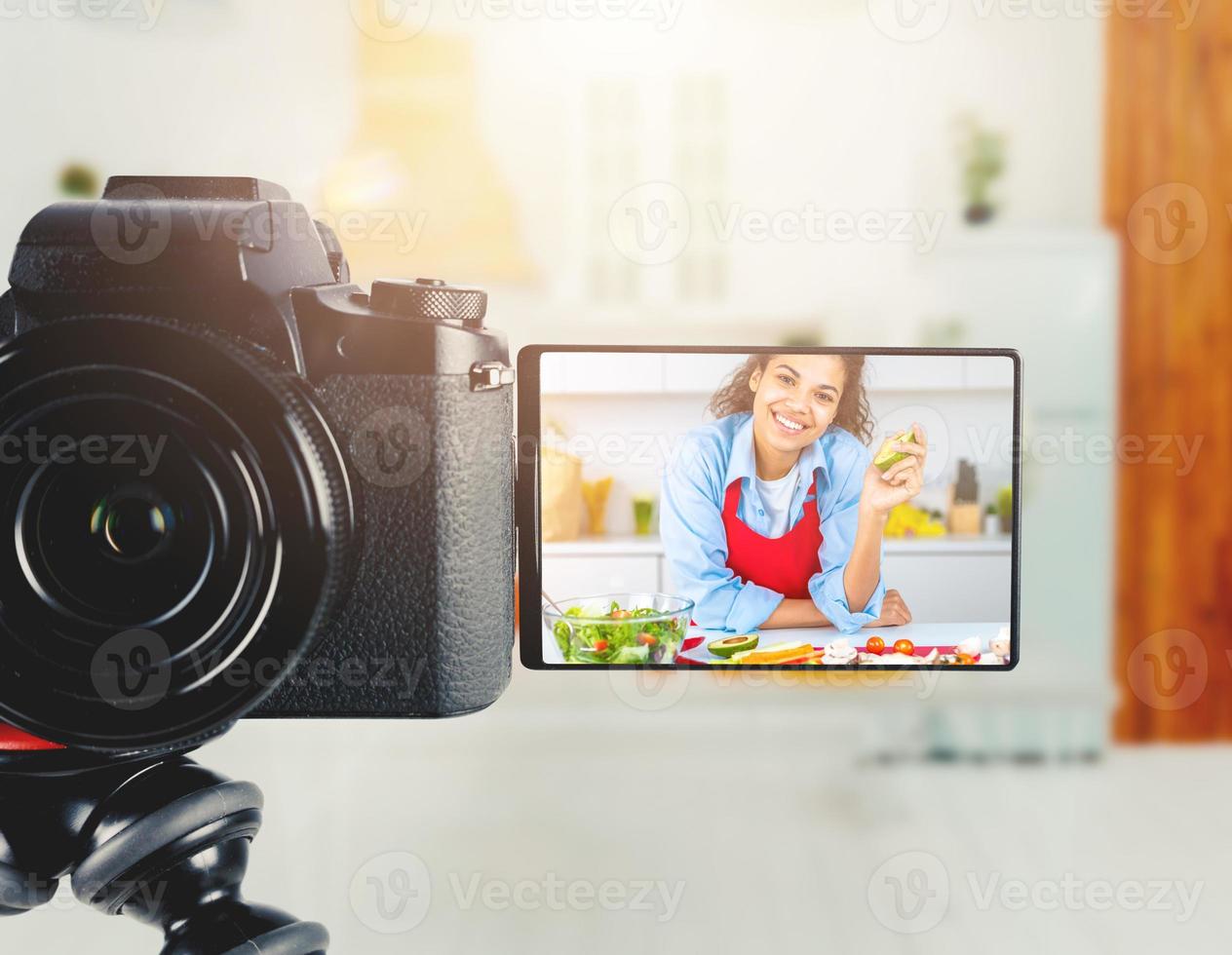 Vlogger woman chef records a video of cooking recipe photo