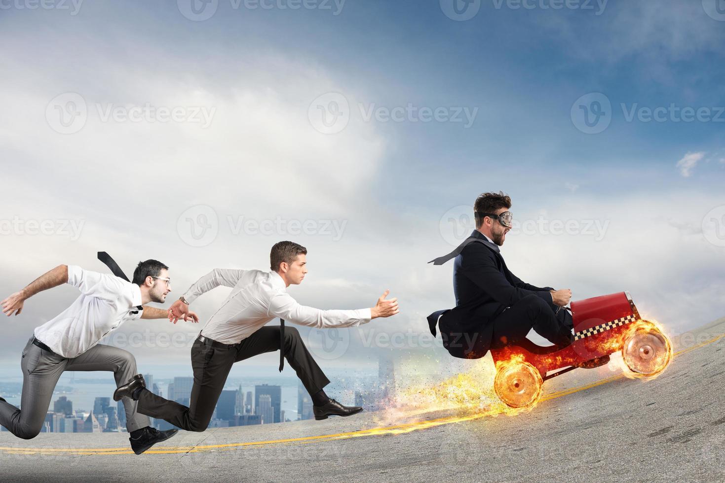 Fast businessman with a car wins against the competitors. Concept of success and competition photo