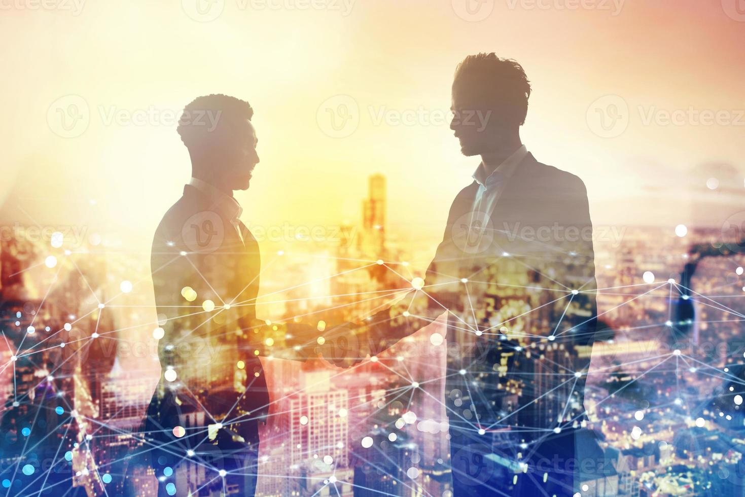 Handshake of two businessperson in office with network effect. concept of partnership and teamwork photo