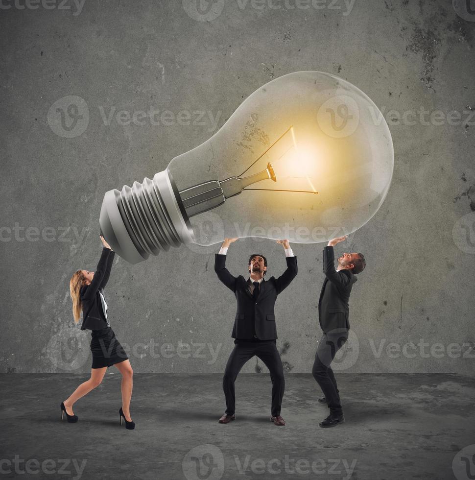 Business people hold a light bulb. concept of new idea and company startup photo