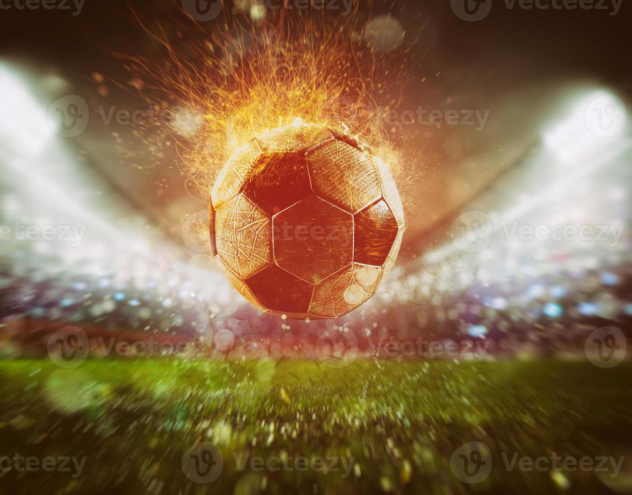 Close up of a fiery soccer ball kicked with power at the stadium scoring a goal photo