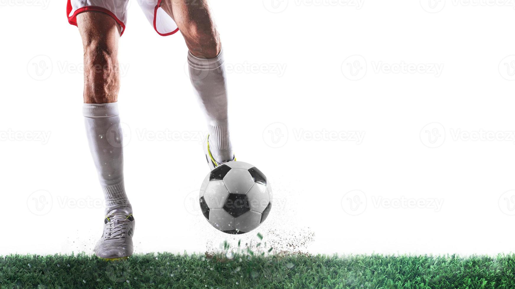 Football scene with player ready to shoot the ball on white background photo