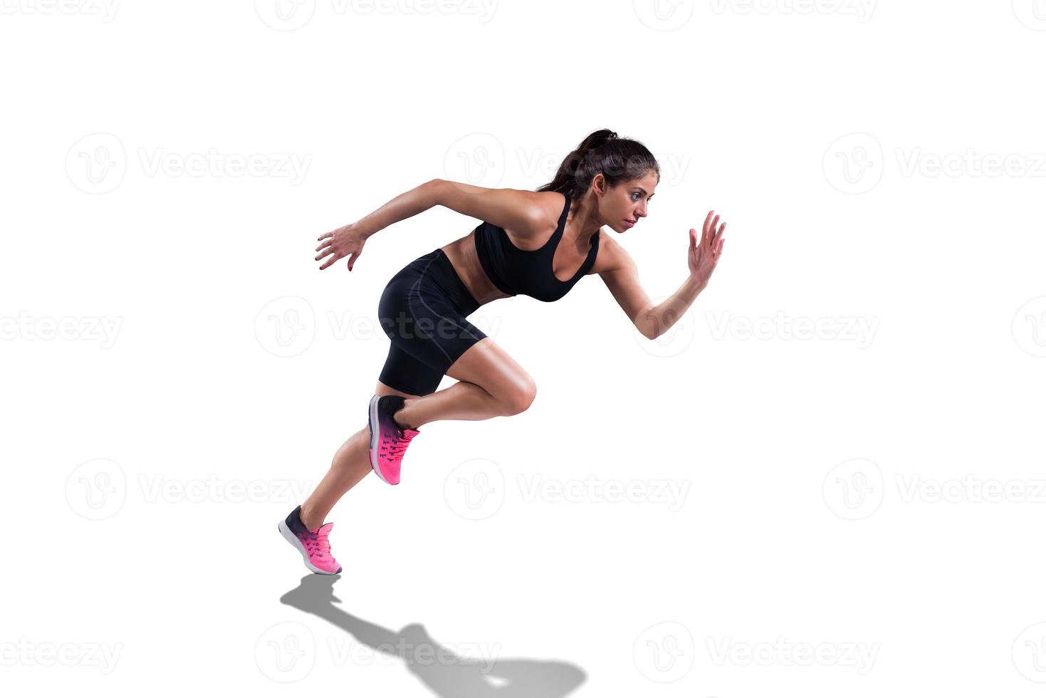 Athletic woman runs fast isolated on white background photo