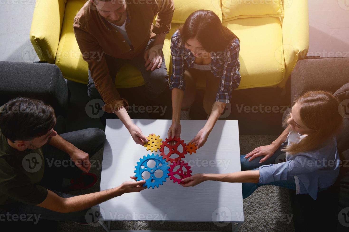Business team connect pieces of gears. Teamwork, partnership and integration concept photo