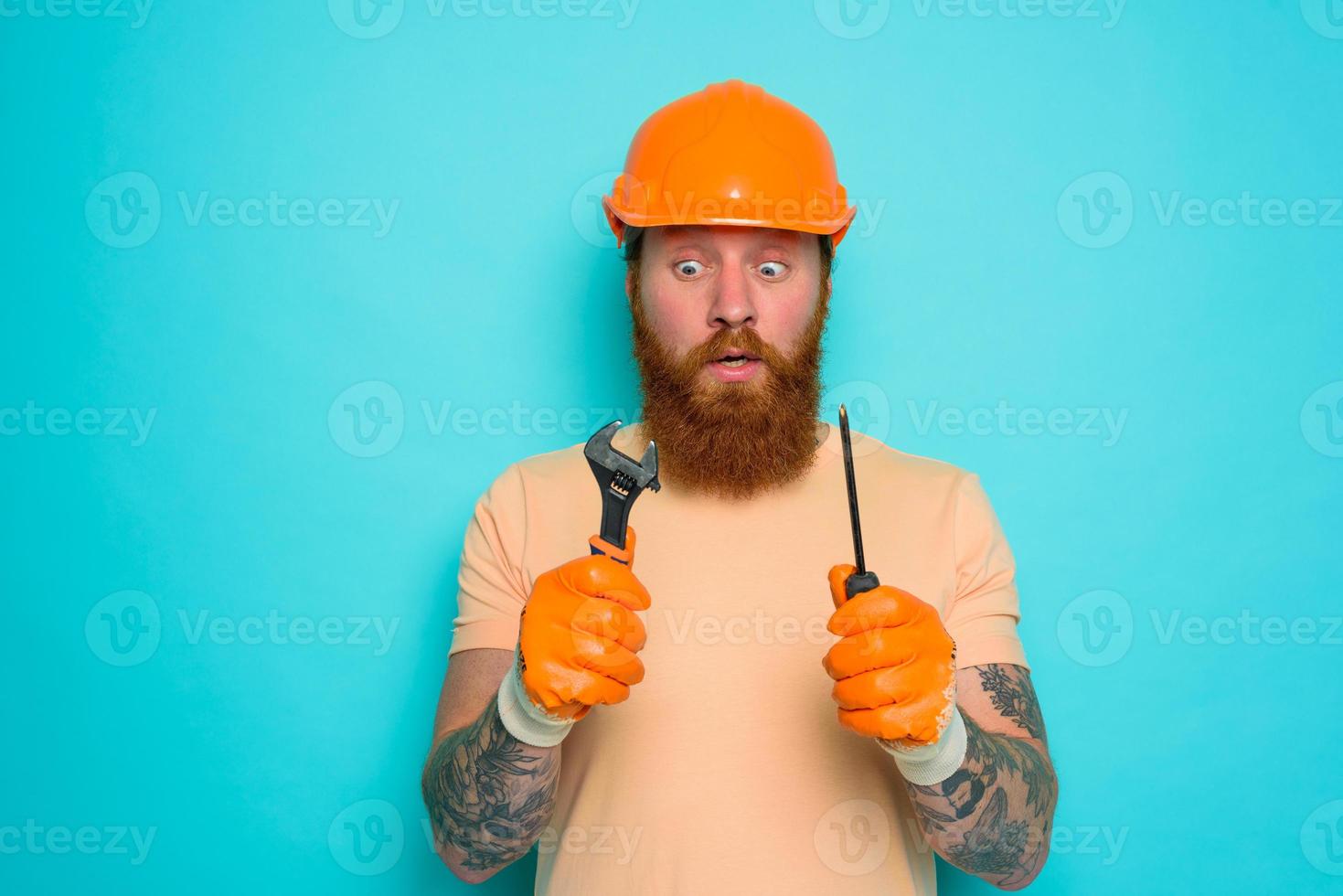 Incompetent worker is afraid and worried about his work photo