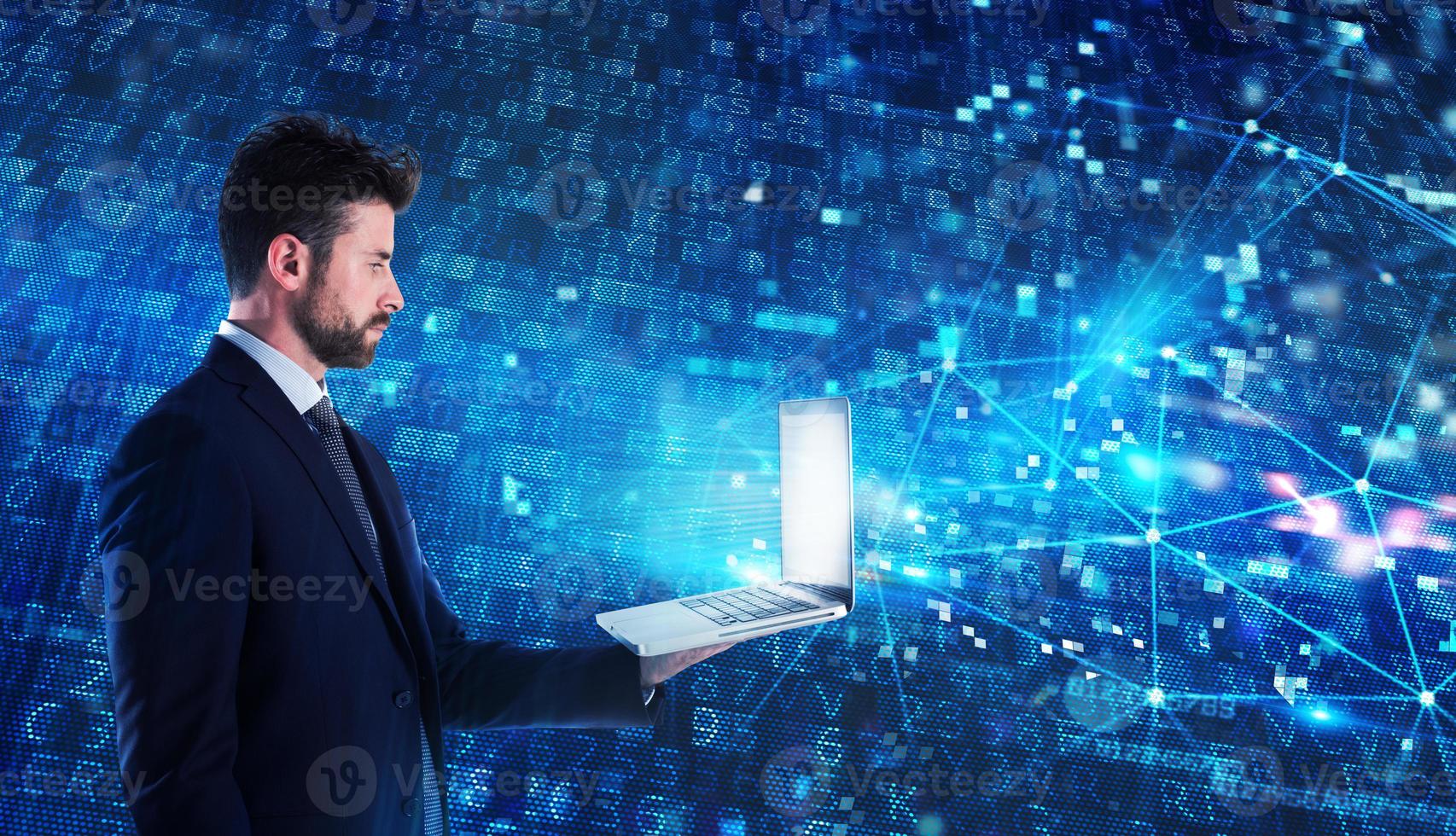 Programmer man works with a laptop on a network application photo